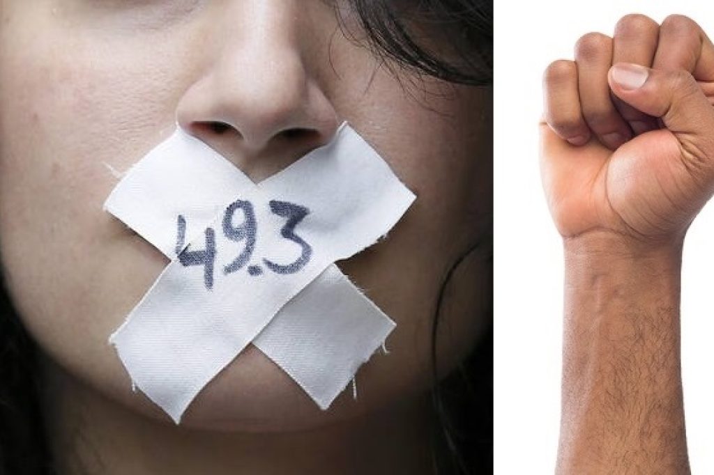 A woman with the numbers, "49-3" symbolically taped across her mouth attends a demonstration against French labour law reform in Paris, France, May 12, 2016.  REUTERS/Gonzalo Fuentes